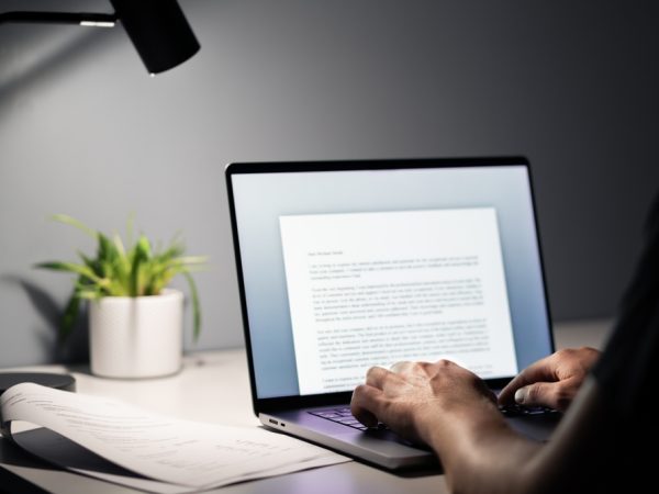Man,Writing,Text,Document,,Essay,Or,Letter,With,Laptop.,Freelance